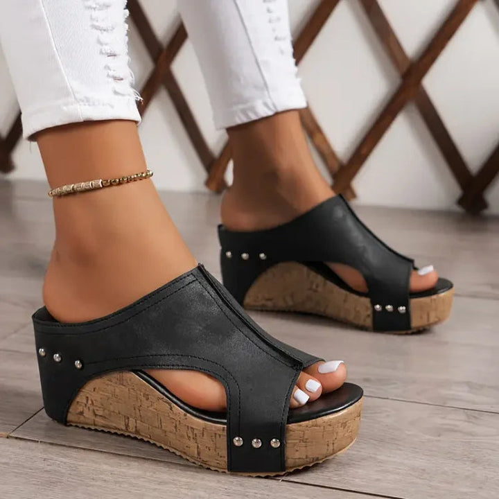 Women's minimalist open-toe wedge sandals with arch support for comfortable walking.