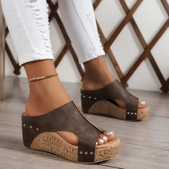 Minimalist women's open-toe wedge sandals featuring adjustable straps & orthopedic arch support.