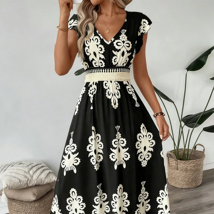 Elegant women's graphic print A-line midi dress, a sophisticated day-to-night garment.
