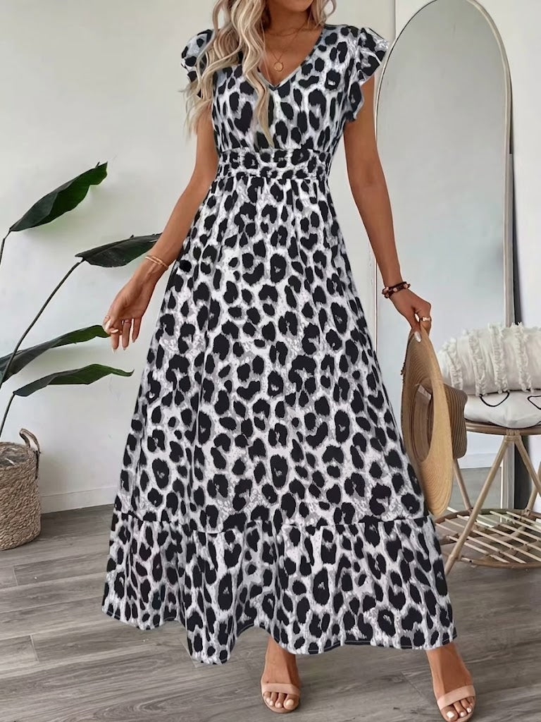 Flattering women's A-line midi dress featuring an elegant graphic print, ideal for any event.