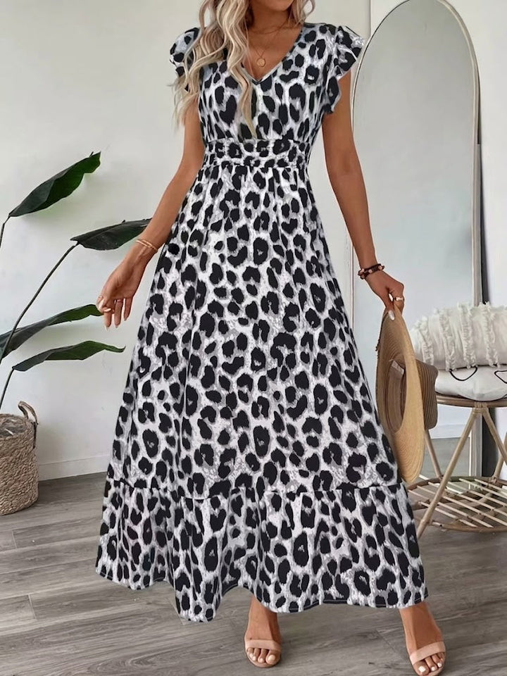 Flattering women's A-line midi dress featuring an elegant graphic print, ideal for any event.