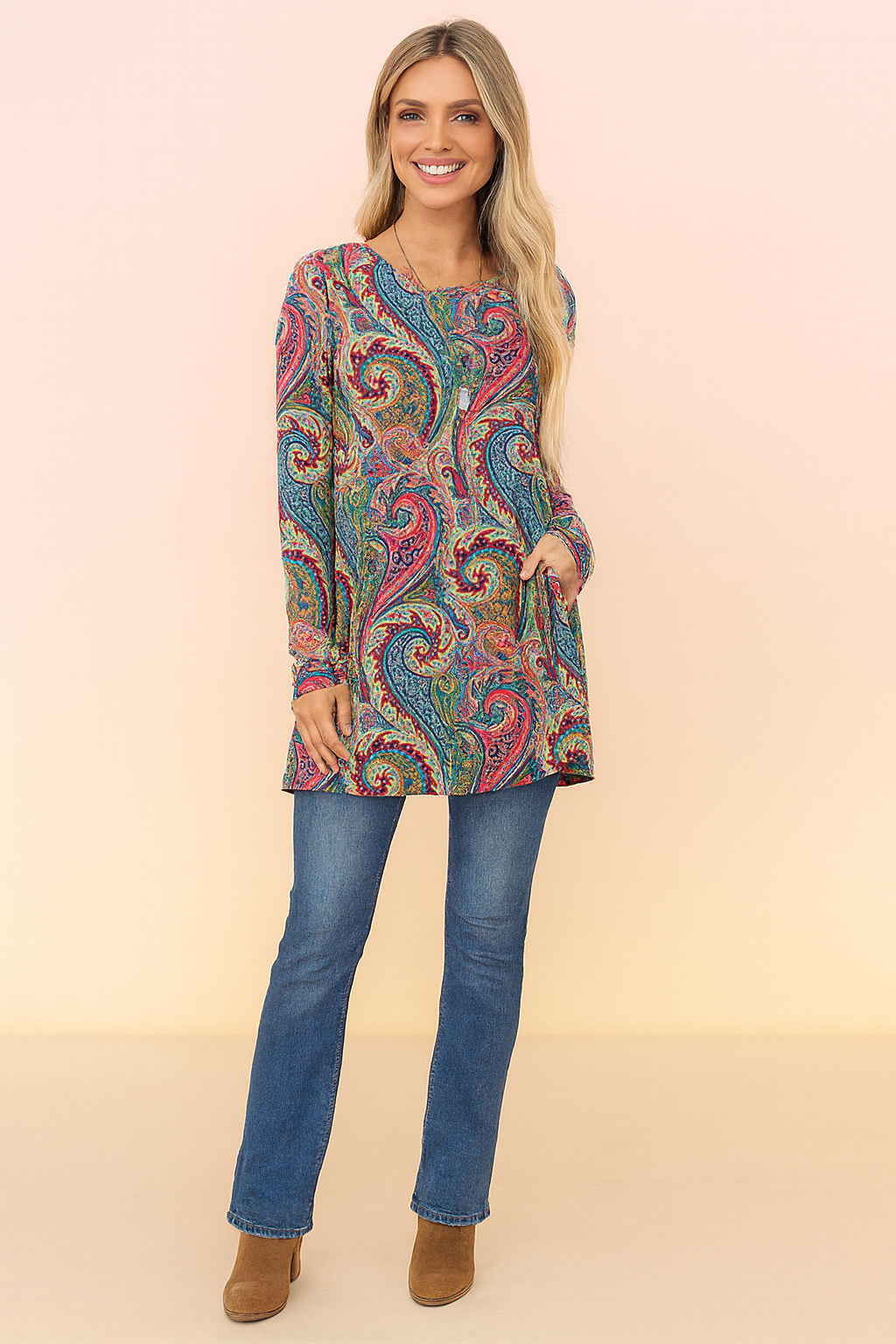 Colorful oversized women's sweater featuring an elegant paisley print. Cozy long-sleeve knit for stylish fall outfits.