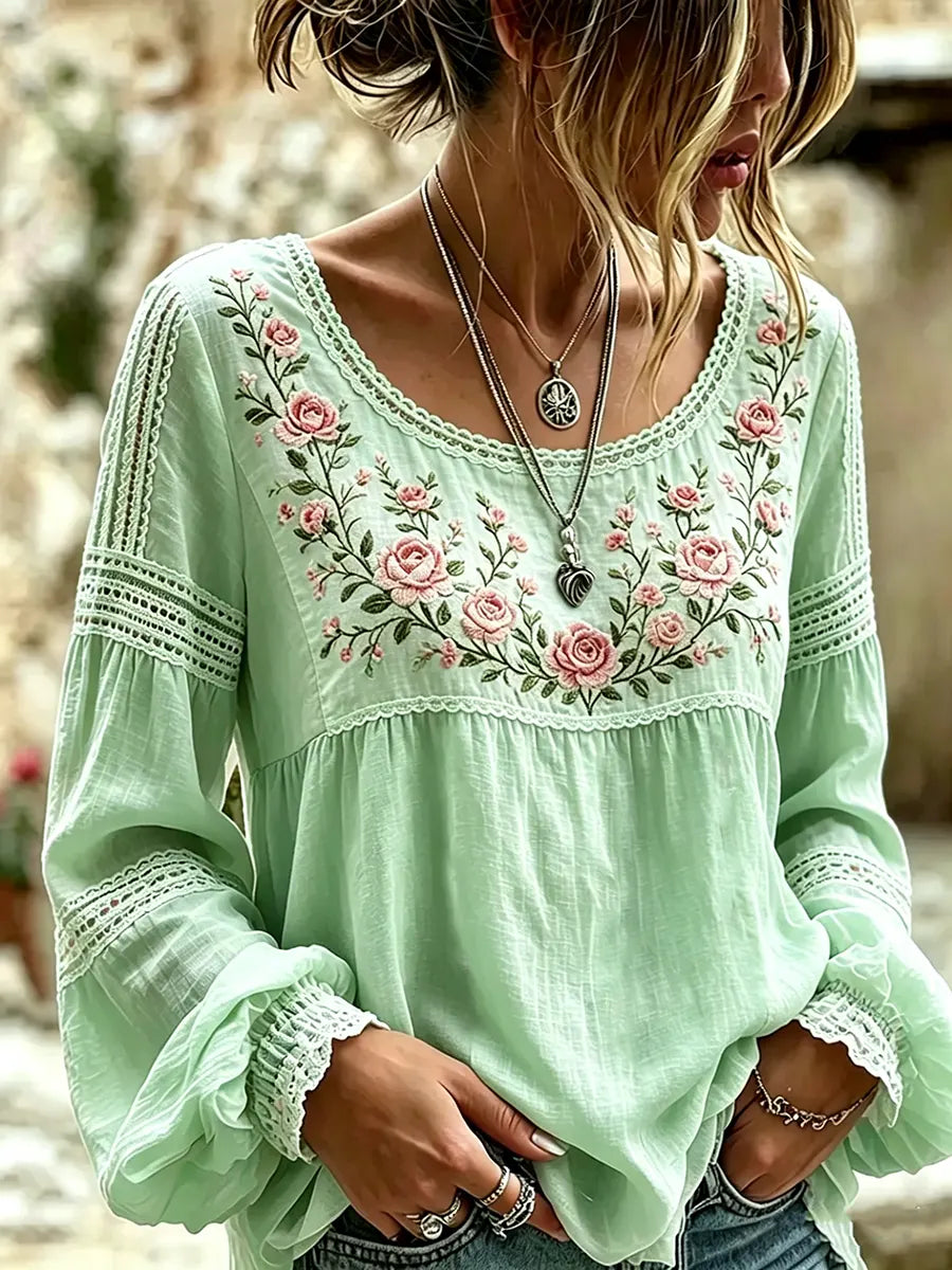 Relaxed fit women's long sleeve blouse with beautiful floral embroidery, ideal for comfortable casual style.