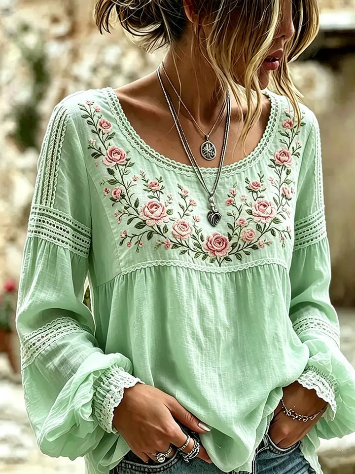 Relaxed fit women's long sleeve blouse with beautiful floral embroidery, ideal for comfortable casual style.