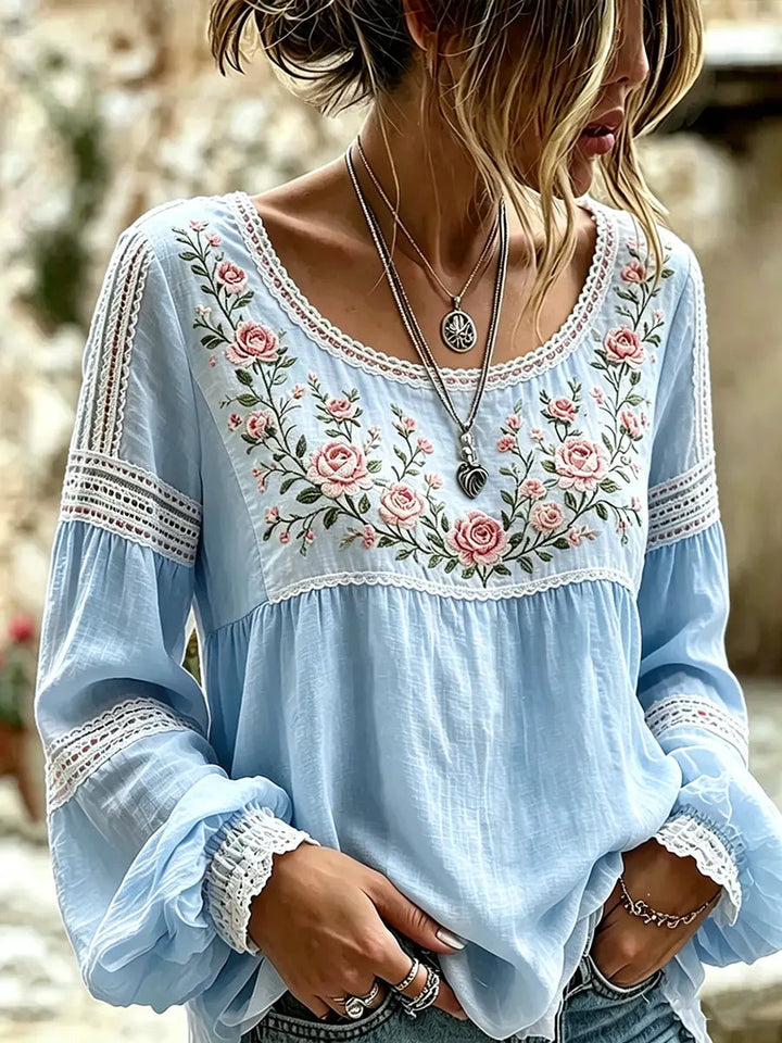 Stylish ladies top: embroidered floral blouse with relaxed long sleeves, versatile for spring & summer.
