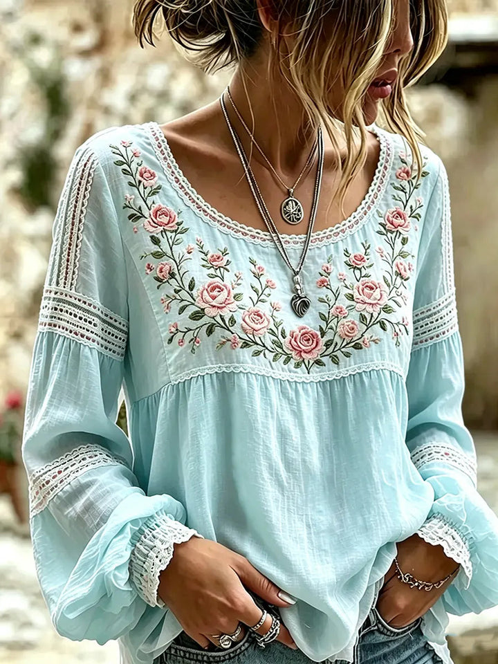 Versatile women's embroidered floral blouse with relaxed long sleeves, a stylish and comfortable ladies top.