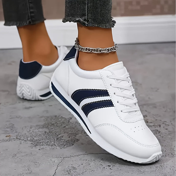 Stylish women's orthopedic sneakers, lightweight design with cushioned sole for everyday walking comfort.