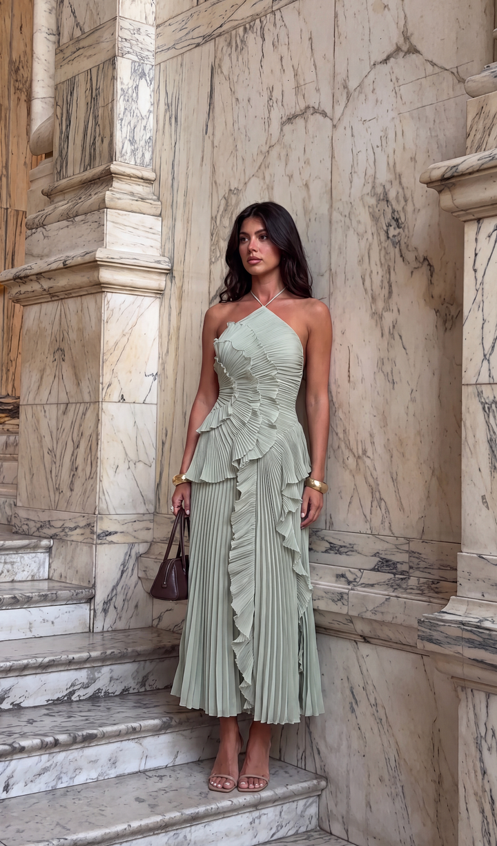 Vacation-ready halterneck maxi dress for women, sleeveless with charming ruffles and a trendy asymmetric hemline.