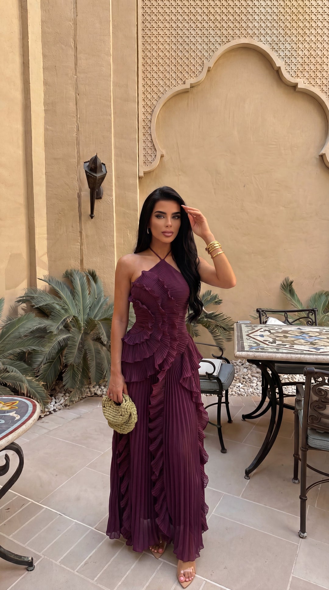 Sophisticated evening gown, women's halterneck maxi style with a beautiful ruffle and a distinctive asymmetric hem.
