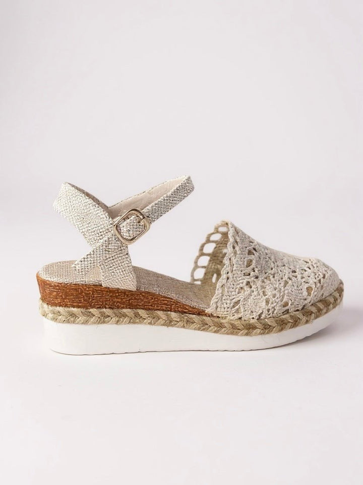 Elegant women's boho espadrille sandals featuring intricate crochet detailing and secure anklestrap.