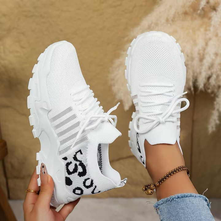 Supportive women's sneakers with arch support, ideal for walking, foot relief & athletic comfort.