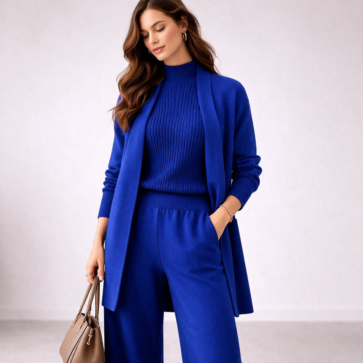 Elegant women's relaxed fit three-piece knit lounge set. Includes comfy wide-leg pants, mock neck & long cardigan.