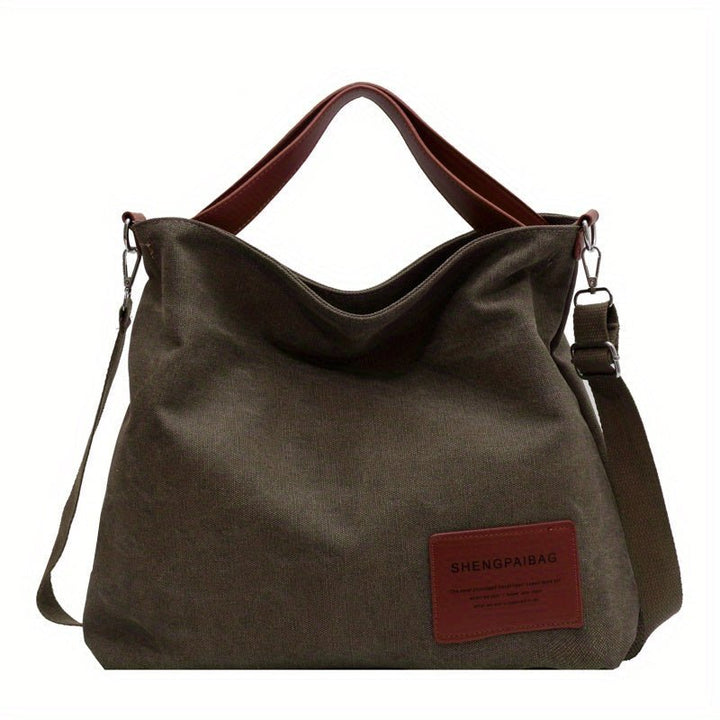 Durable large canvas shoulder tote bag in cream white for women, an everyday work or travel bag with adjustable strap.