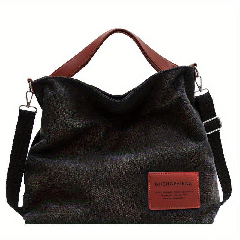 Women's large canvas shoulder tote bag, available in cream white or black, with a practical adjustable strap.