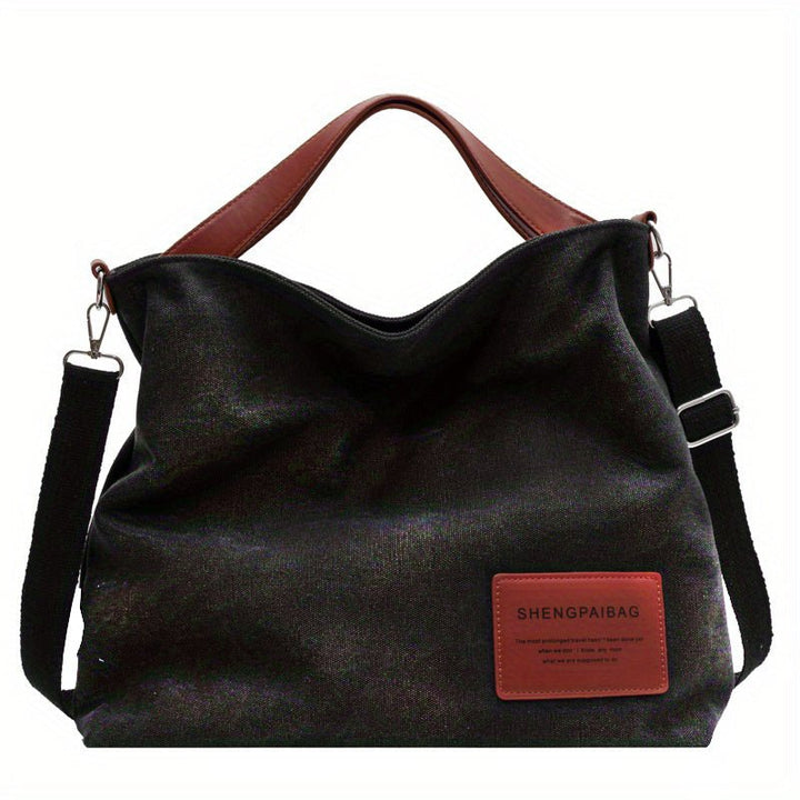 Women's large canvas shoulder tote bag, available in cream white or black, with a practical adjustable strap.
