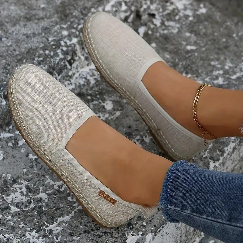 Women's lightweight espadrille flats, perfect for comfortable summer wear. Slip-on casual footwear.
