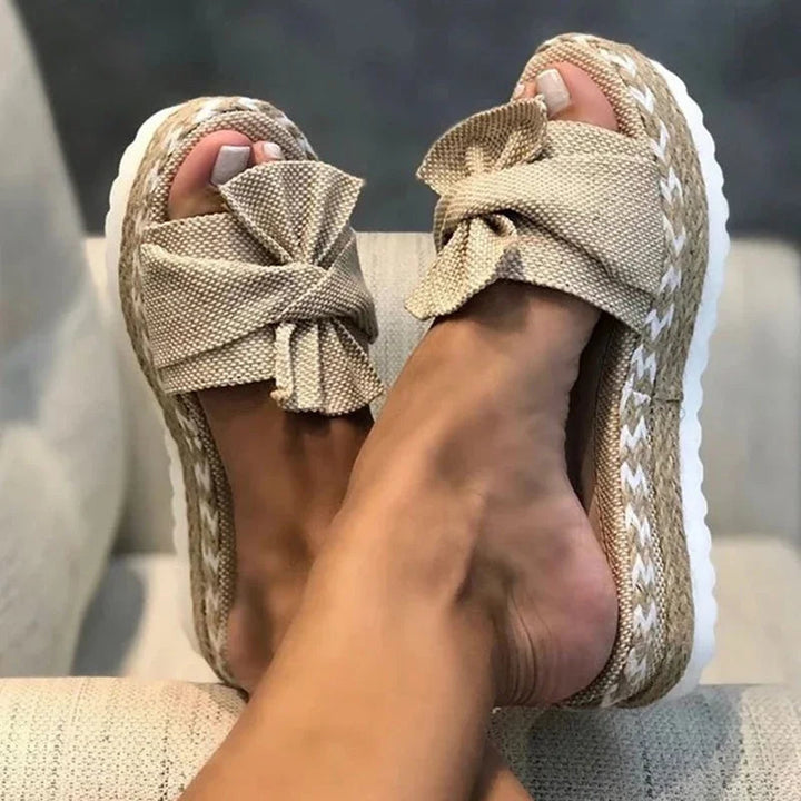 Women's elegant bow woven wedge sandals, perfect for summer comfort & style.