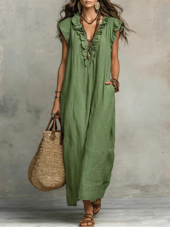 Stylish women's sleeveless maxi dress, featuring a flattering V-neck and delicate ruffles.