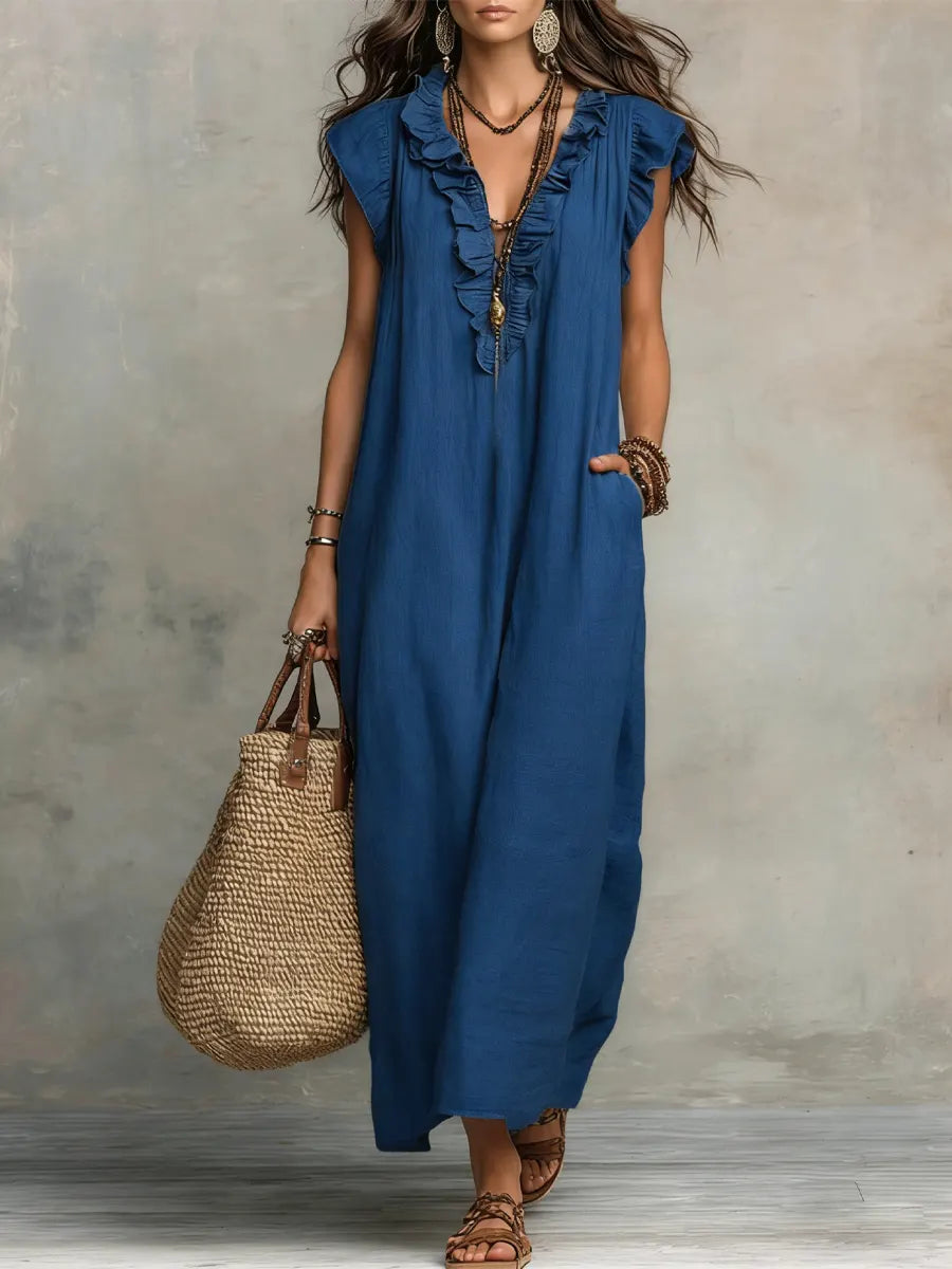 Flowing long summer dress for women, designed with an elegant V-neck and charming ruffle details.