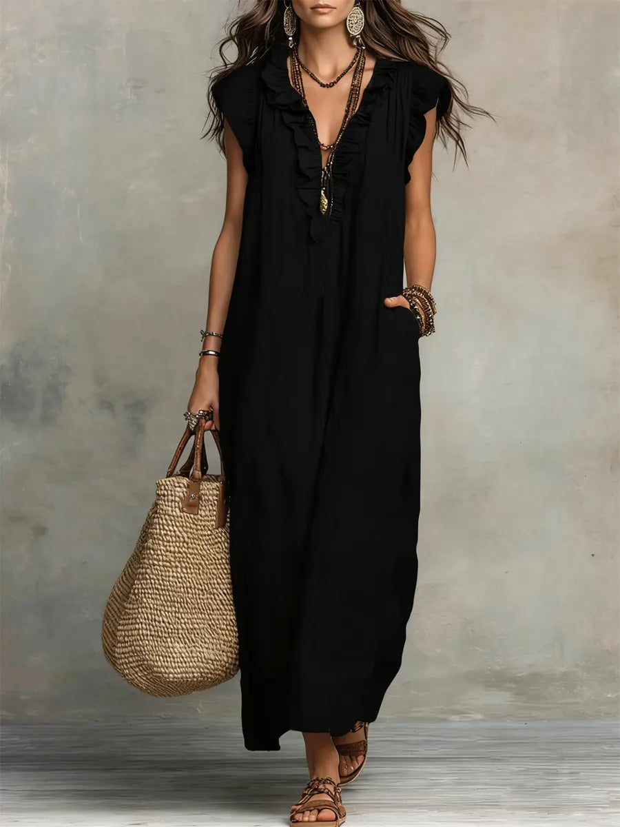 Women's sleeveless V-neck maxi dress in a vibrant color, showcasing its elegant flowing design.