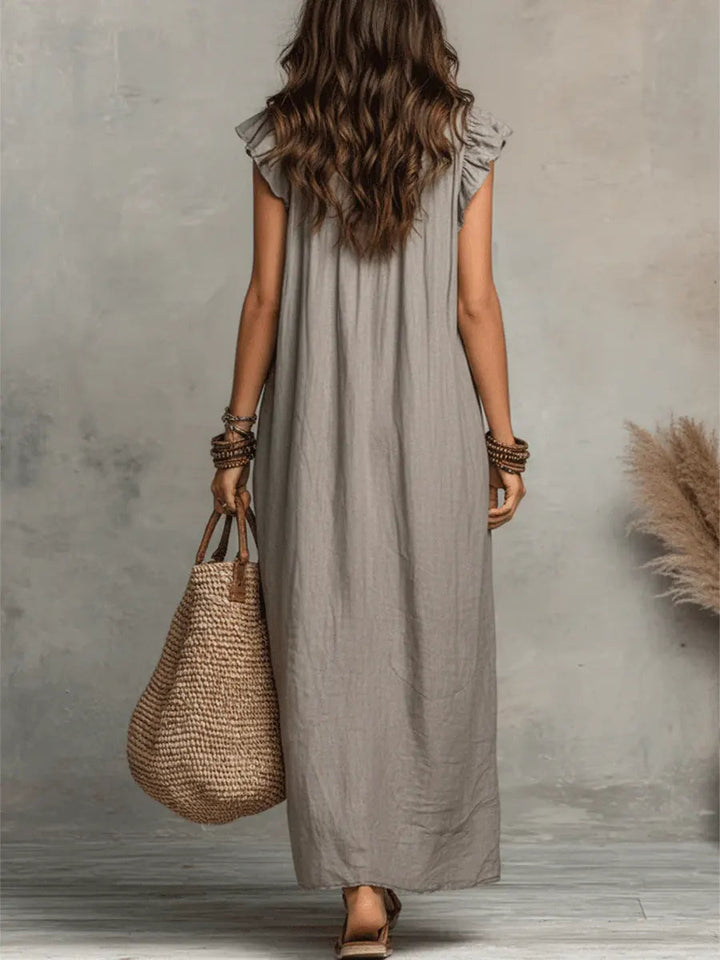 Chic women's long ruffle V-neck maxi dress, designed for comfort and elegance on sunny days.