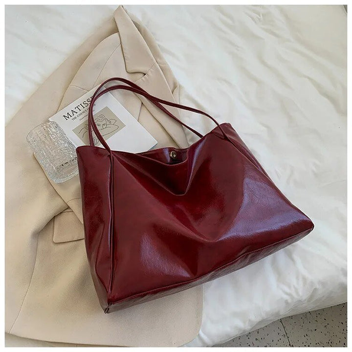 Stylish women's retro PU leather shoulder purse, a large capacity tote bag ideal for work and daily style.