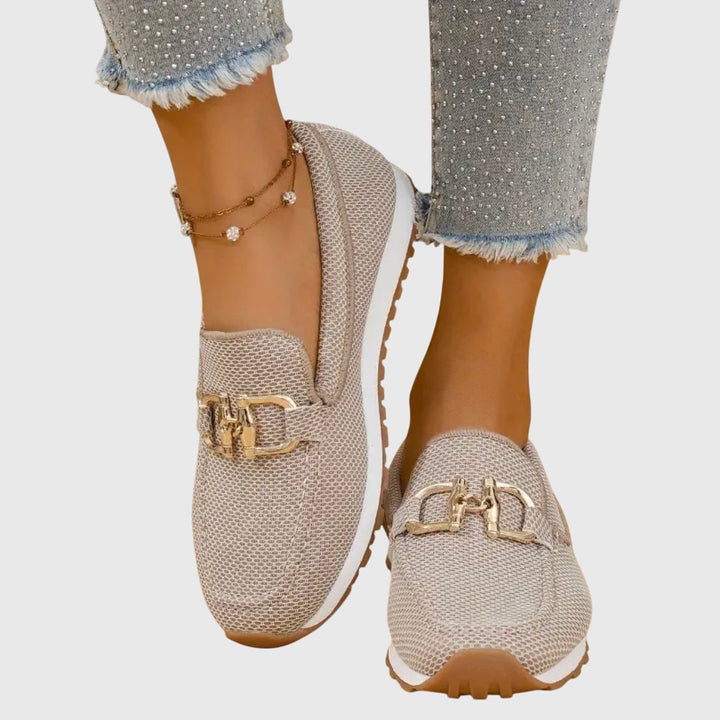 Beige women's orthopedic slip-on loafers with arch support for comfortable all-day walking.