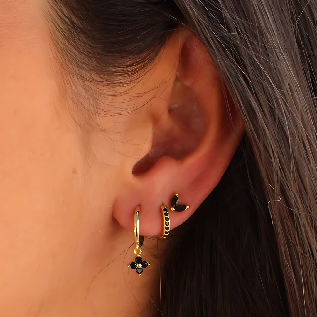 Hypoallergenic surgical steel ear piercing set for women, including diverse hoops & studs for a stackable look.