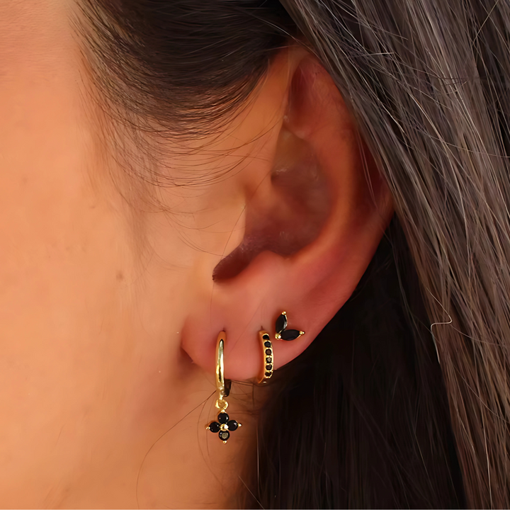 Hypoallergenic surgical steel ear piercing set for women, including diverse hoops & studs for a stackable look.