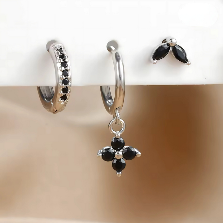 Women's stackable ear piercing set, featuring multiple hypoallergenic surgical steel hoops & studs.