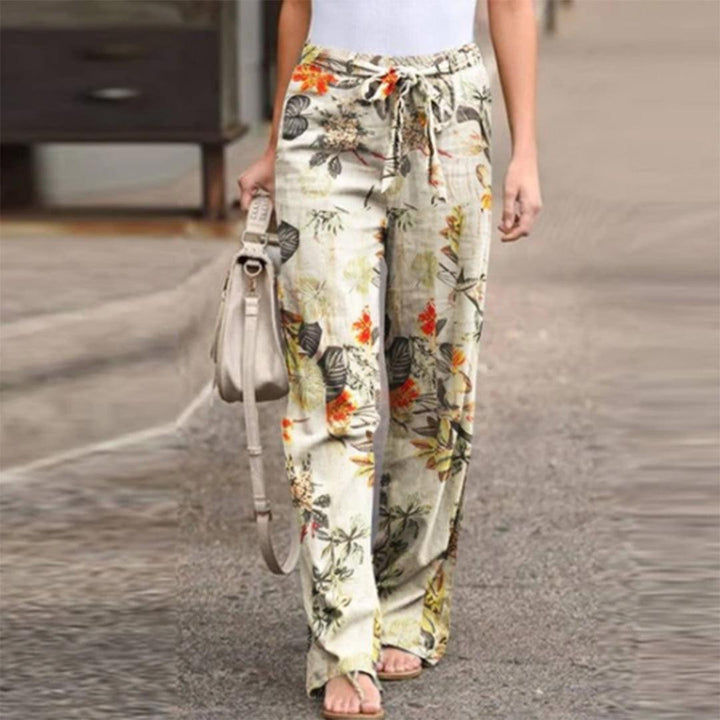 Women's elegant floral print pants with a chic bow detail, perfect for summer fashion.