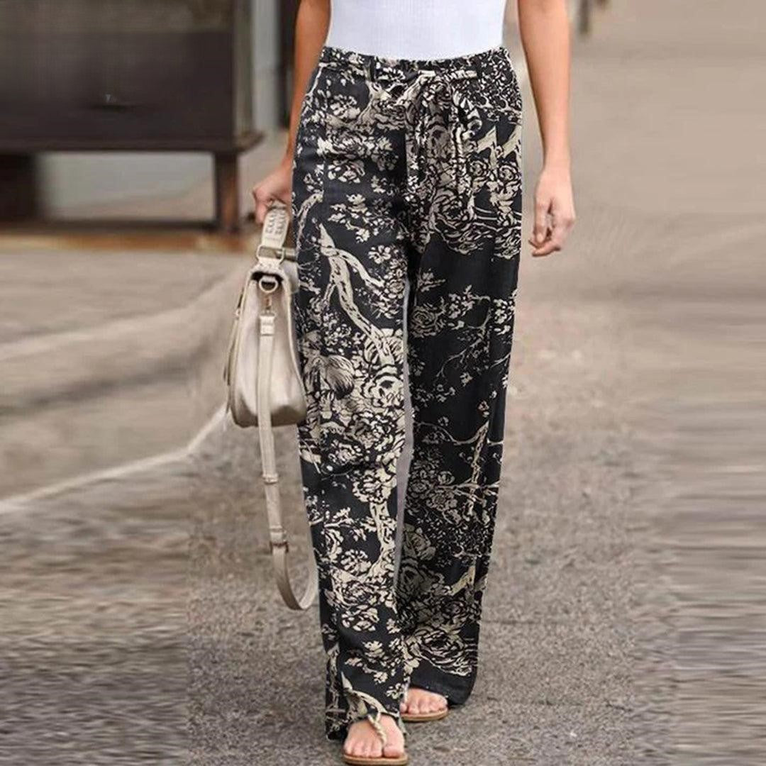 Comfortable women's floral print pants with bow detail for versatile elegant or casual chic summer wear.