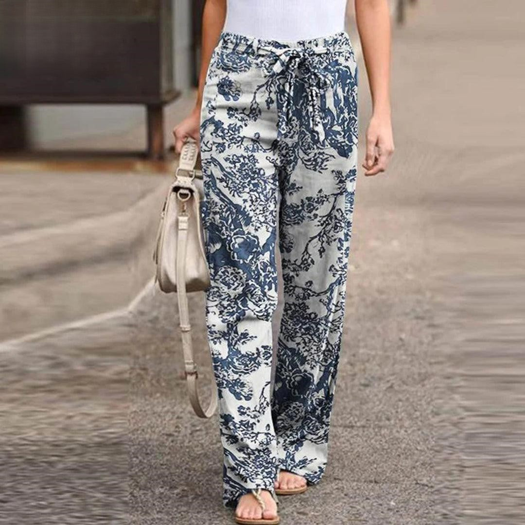 Elegant women's floral print pants featuring a chic bow, offering a relaxed fit for stylish comfort.