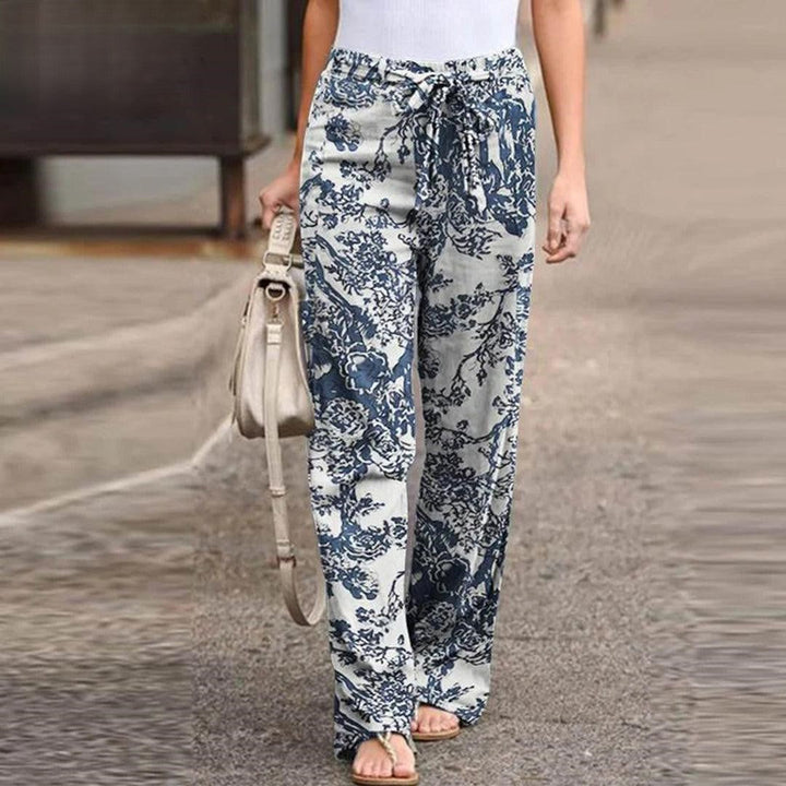 Elegant women's floral print pants featuring a chic bow, offering a relaxed fit for stylish comfort.