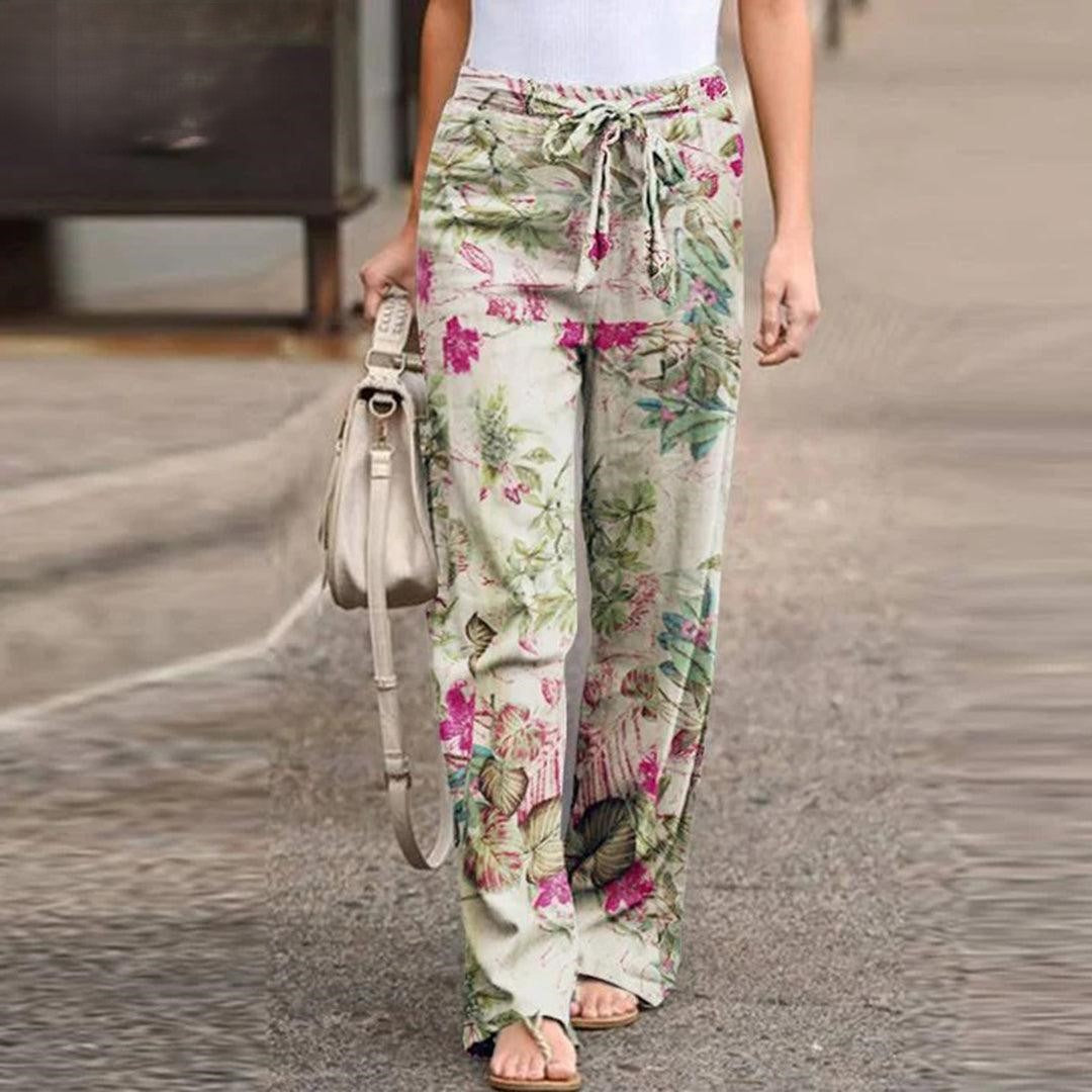 Fashionable women's floral print pants with a chic bow detail, ideal for elegant summer & spring outfits.
