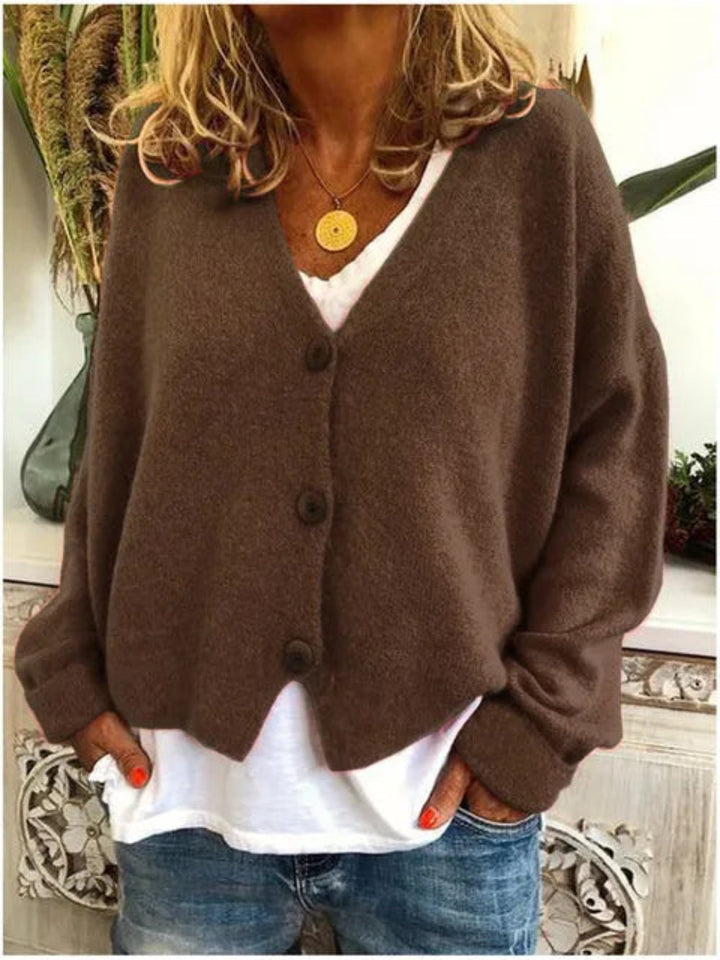 Stylish women's knit V-neck cardigan with a button-front, perfect for adding an elegant layer to spring & autumn outfits.
