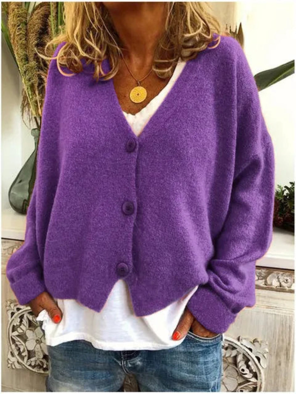 Comfortable women's V-neck button-front knit cardigan, offering a relaxed fit & long sleeves for elegant daily wear.