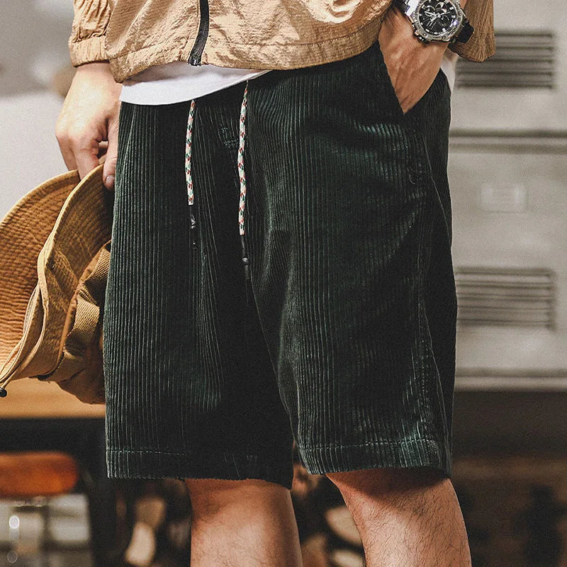 Olive green men's relaxed fit summer shorts, comfortable for beach fashion and vacation essentials.
