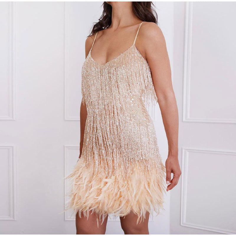 Women's elegant sequin feather cocktail dress. Dazzling party dress perfect for evening events.