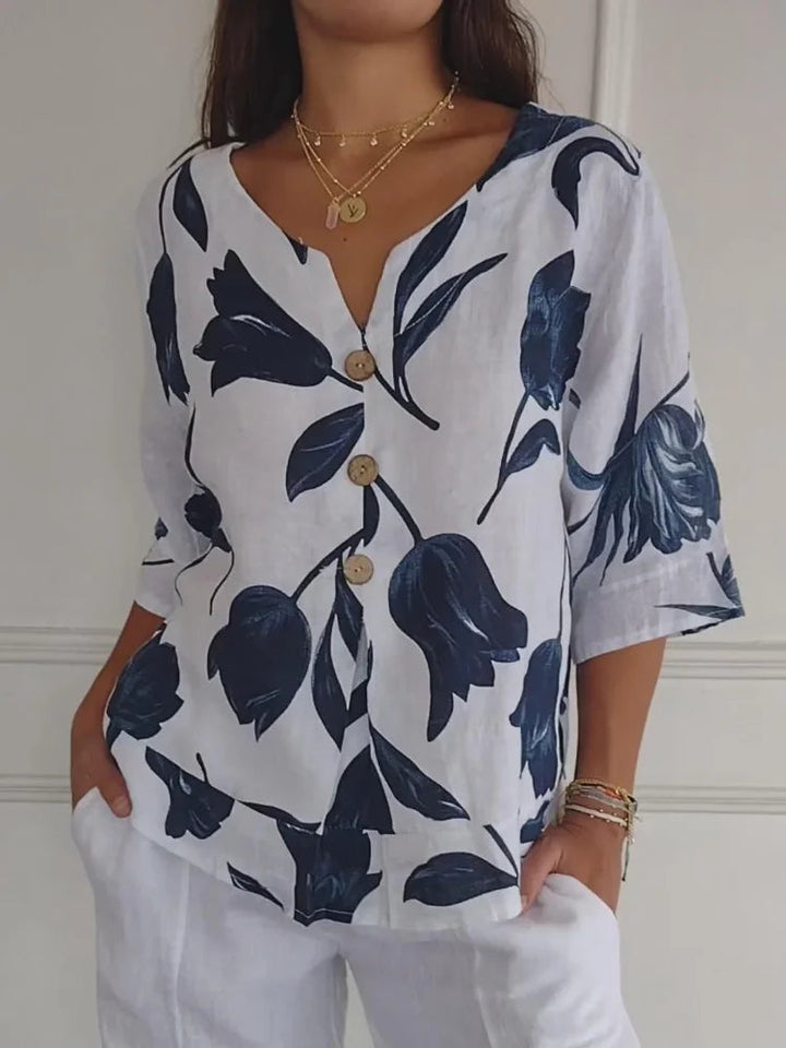 Elegant women's floral button-up blouse with long sleeves. Perfect for office or chic casual spring fashion.