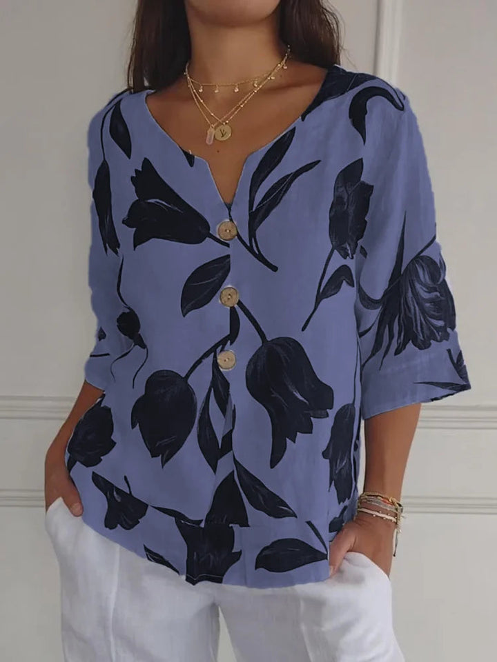 Stylish women's spring floral button-up long sleeve top. Features a delicate print, ideal for office & casual.