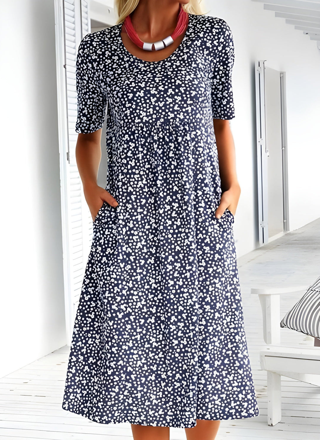 Elegant women's casual floral dress with a round neck and pockets. Ideal for vacation wear, summer, and everyday comfort.