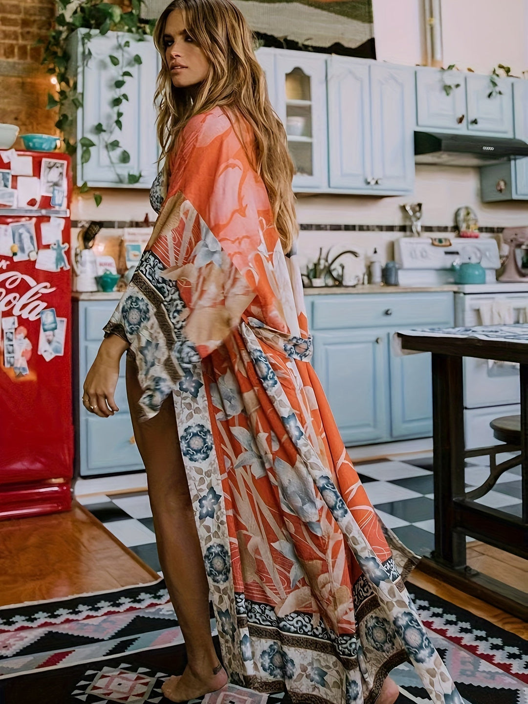 Women's floral kimono with batwing sleeves & belted waist, perfect beach cover-up or summer holiday layering piece.