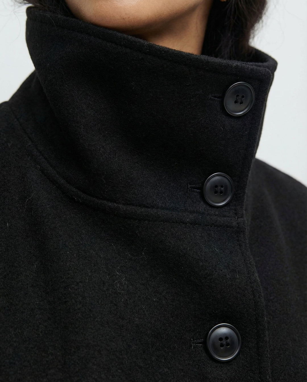 Beautiful women's winter fashion wrap jacket, a high-collar belted trench coat offering warmth & elegance.