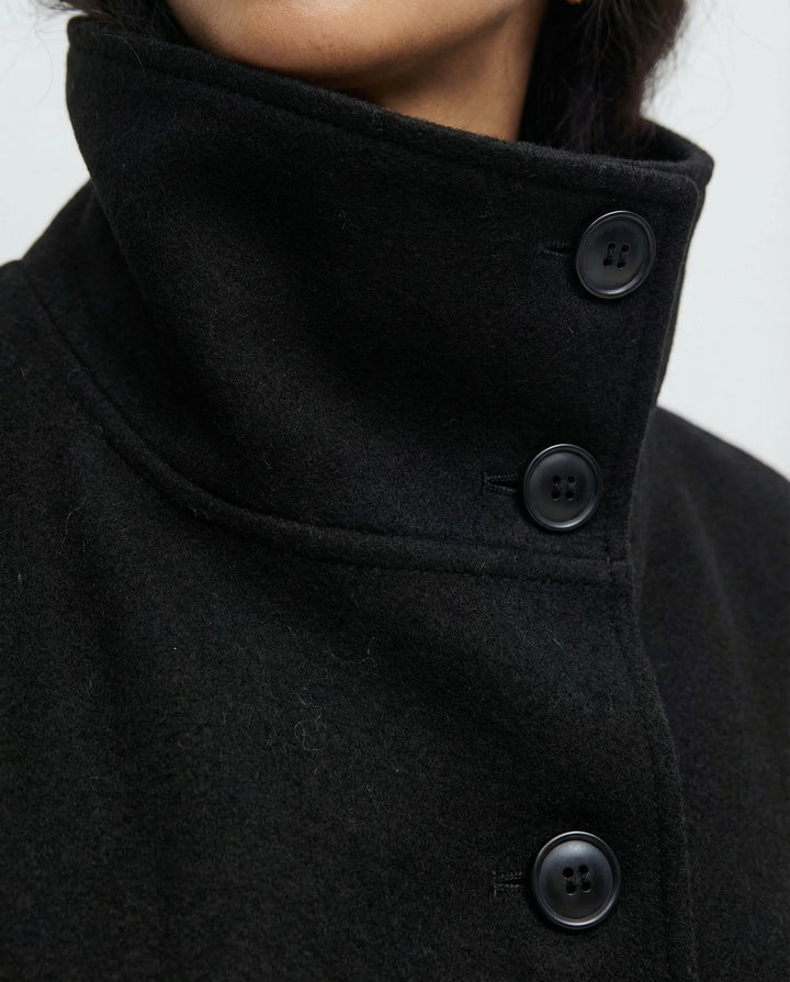 Beautiful women's winter fashion wrap jacket, a high-collar belted trench coat offering warmth & elegance.