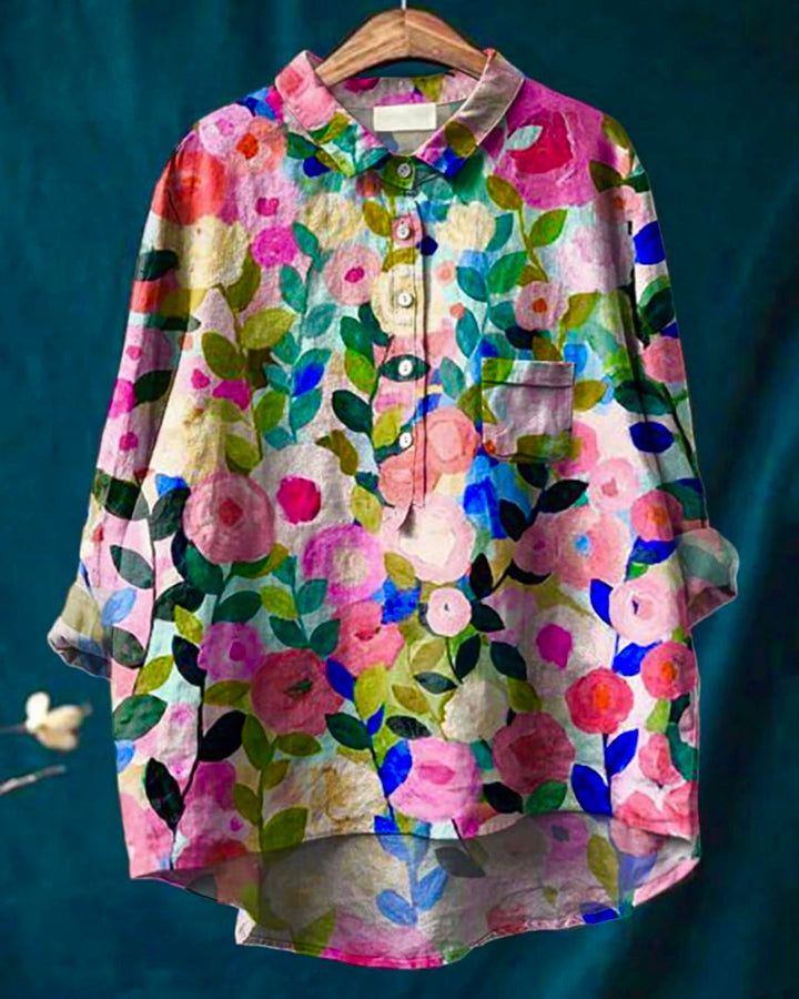 Chic long sleeve women's top featuring a vibrant floral print and button-front, perfect for versatile fashion.