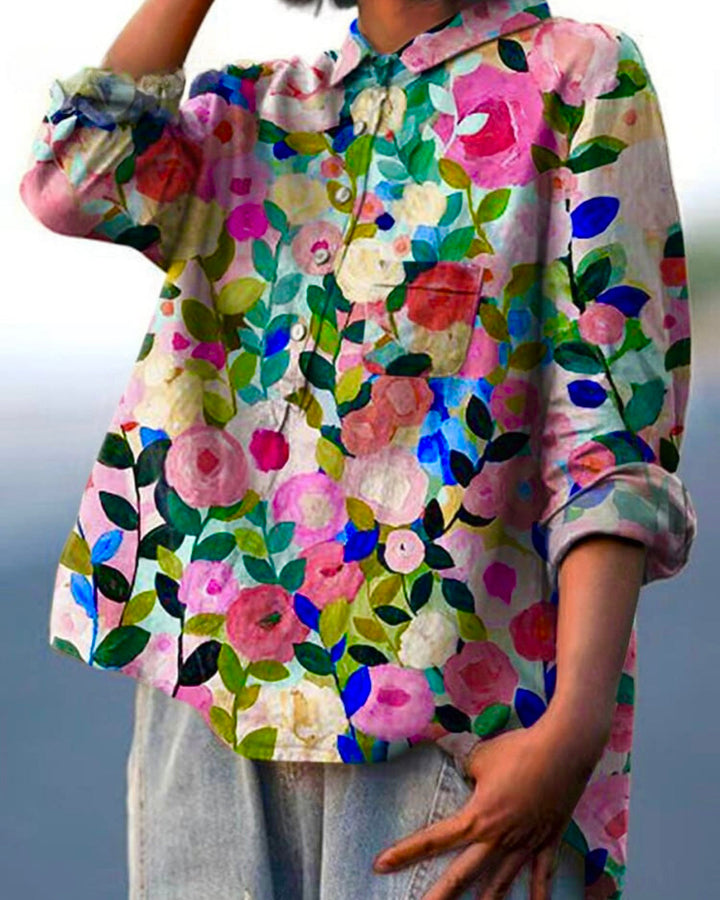 Elegant women's floral button-front blouse with long sleeves, ideal for spring and summer casual wear.