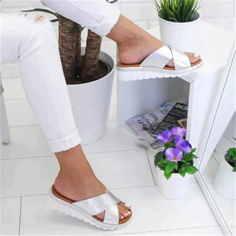 Comfortable women's orthopedic sandals with arch support, elegant slip-on design for stylish summer support.