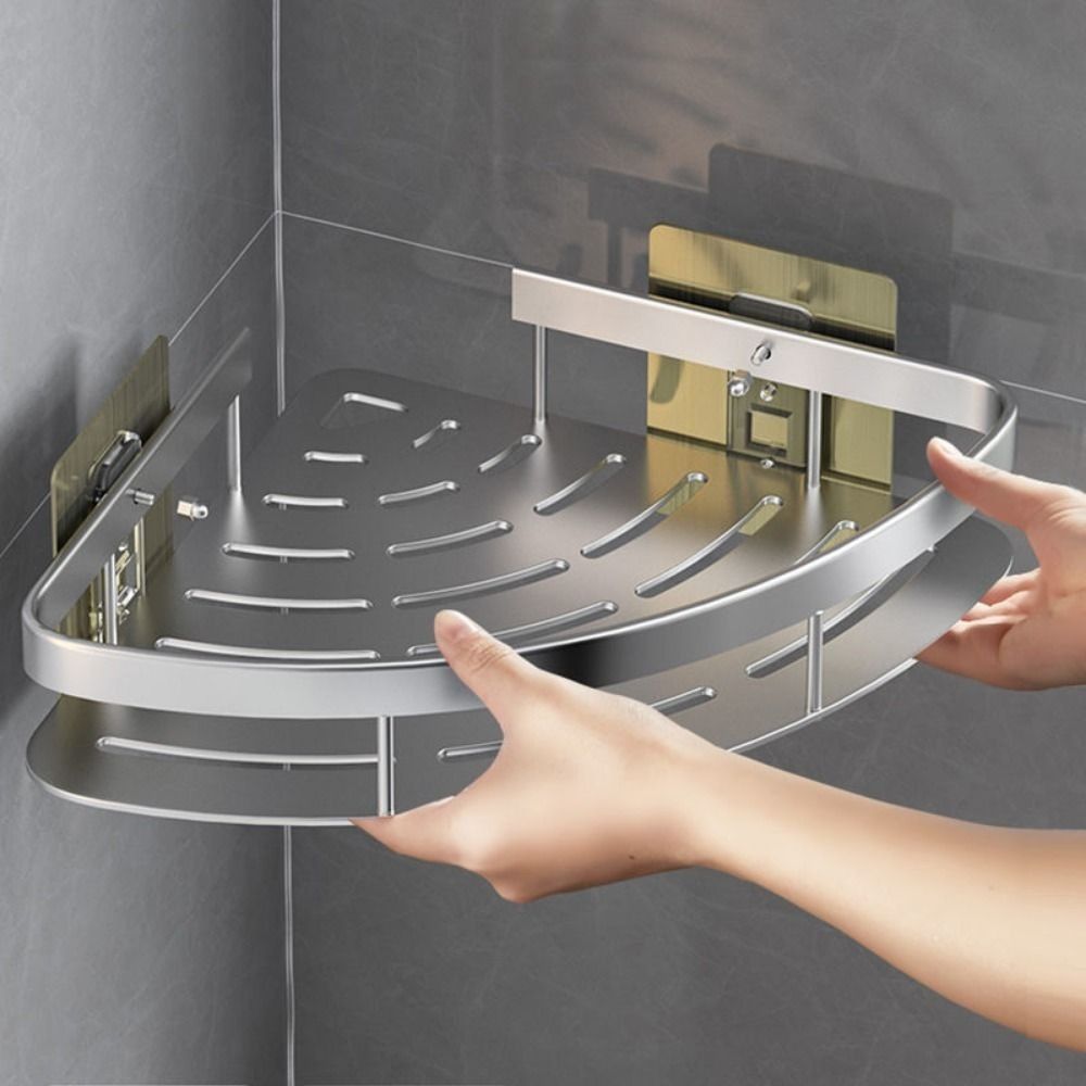 Sleek silver aluminum corner bathroom shelf, wall-mounted for efficient shower storage & organization.