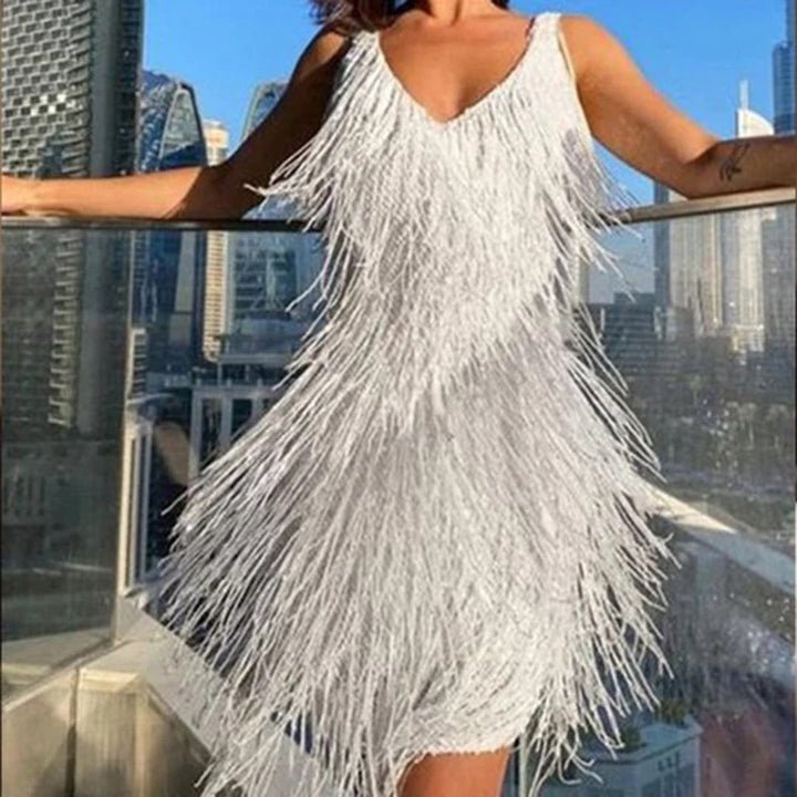 Elegant white mini dress for women adorned with delicate gold tassels, versatile party wear.